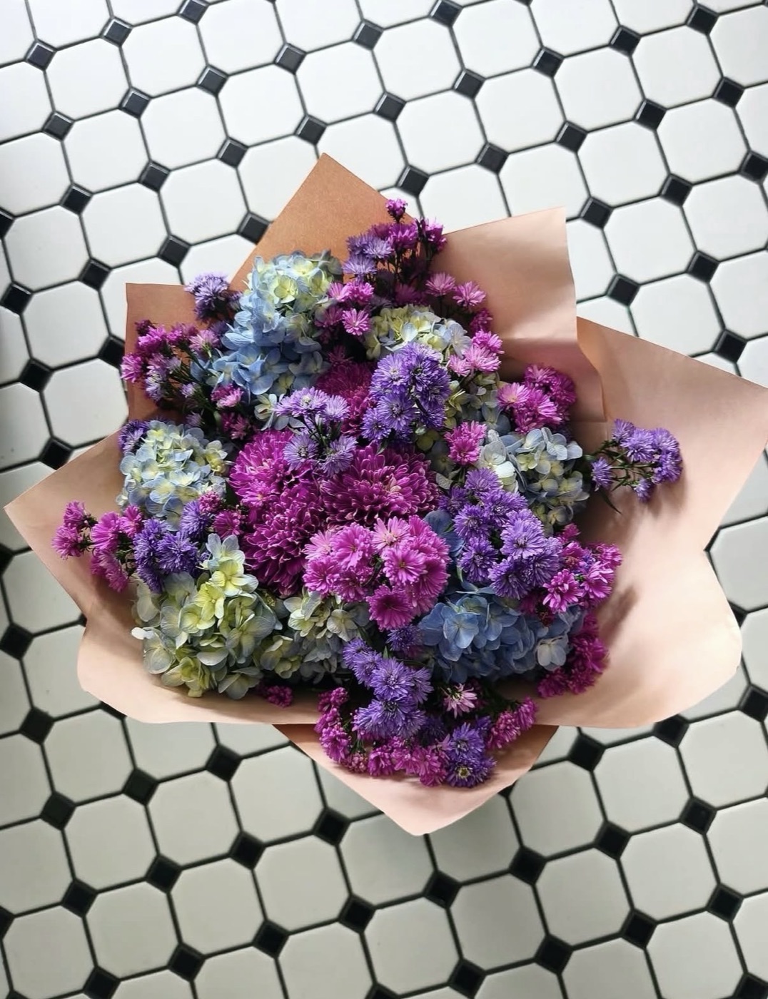 The Pop Of Colour — magenta chrysanthemums, purple asters and blue hydrangea wrapped in blush paper, Maison Bloom Bali
