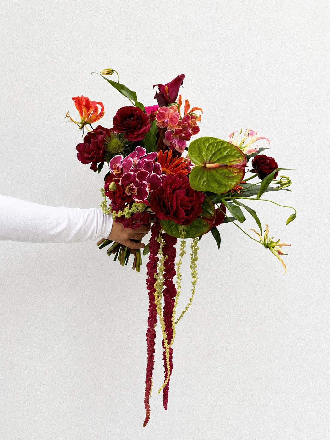 The Hand Bouquet — bridal hand bouquet in burgundy and green by Maison Bloom, Bali wedding florist